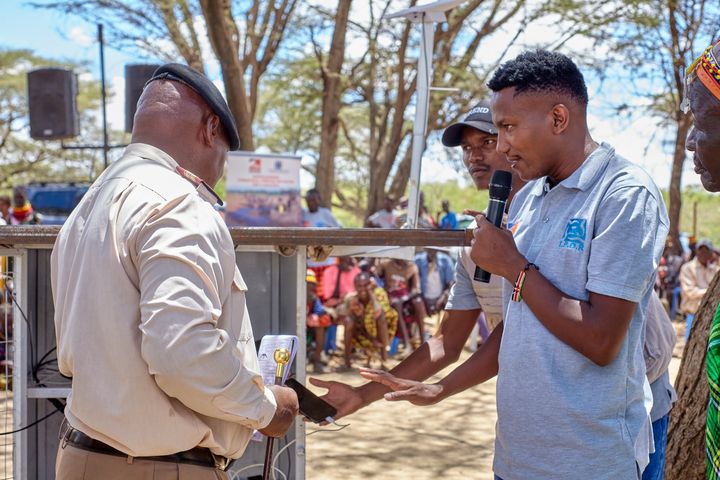 An IPDR team member speaking to the community
