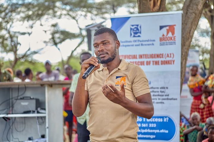 A Brooke East Africa representative addressing the community