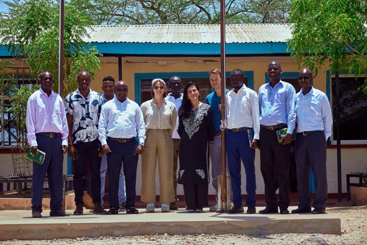IPDR staff, partners and local leaders outside the office